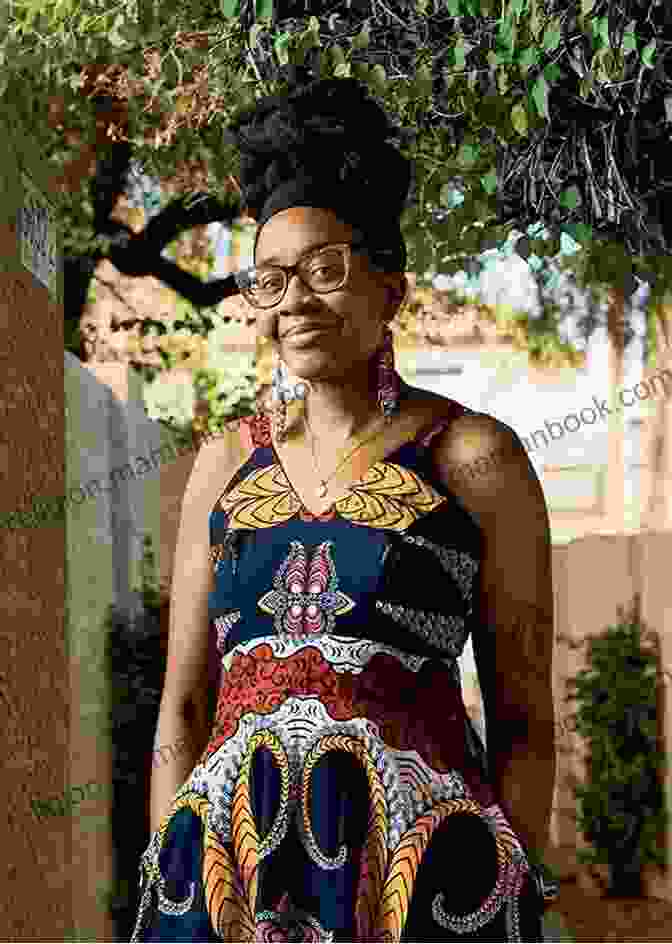 A Headshot Of Noor Nnedi Okorafor, A Smiling Woman With Short, Natural Hair And Glasses. Noor Nnedi Okorafor